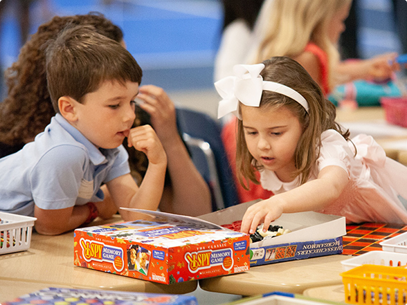Preschool children playing memory game at kids ministry in Dallas, TX.